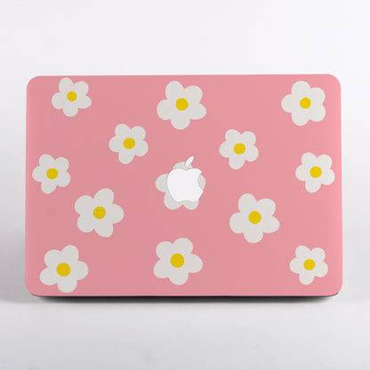 MacBook with pink daisy pattern case