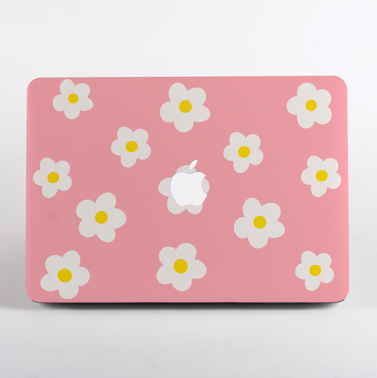 MacBook with pink daisy pattern case