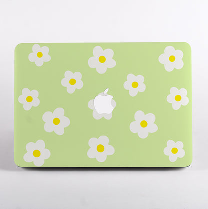 MacBook with green daisy pattern case