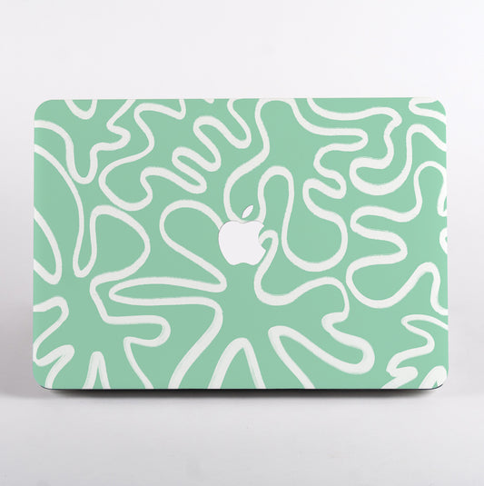 MacBook with mint green and white line patterned case 
