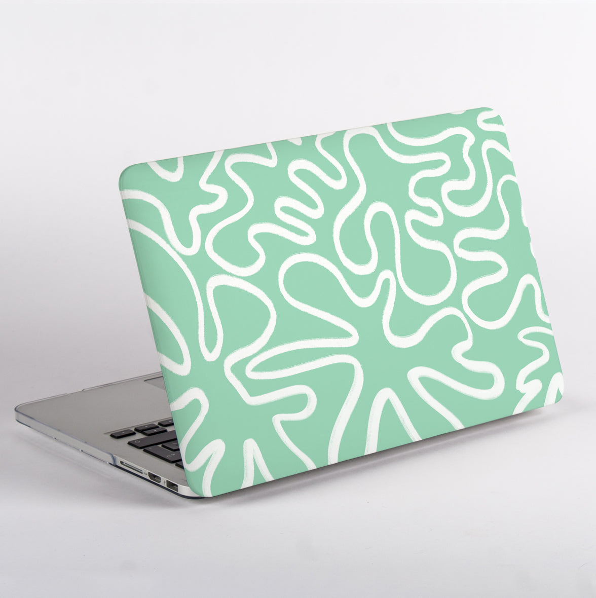 Side view of MacBook with mint green and white line patterned case 