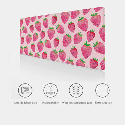 Strawberry patterned desk mat with anti-slip rubber base and other features on a white background