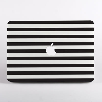 Black and white striped pattern MacBook case on a MacBook with white background.