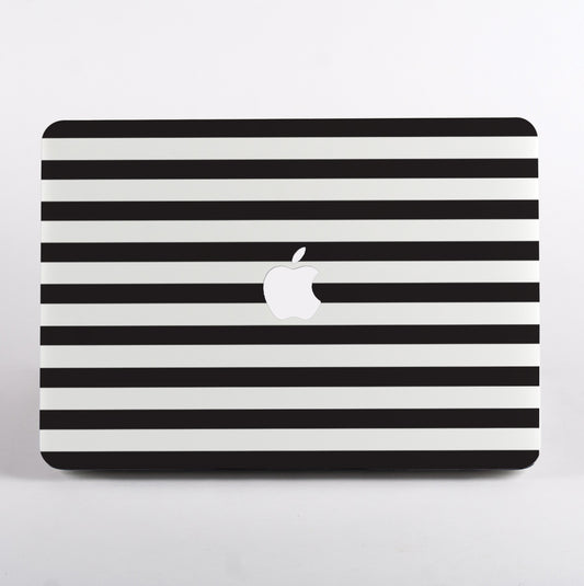 Black and white striped pattern MacBook case on a MacBook with white background.