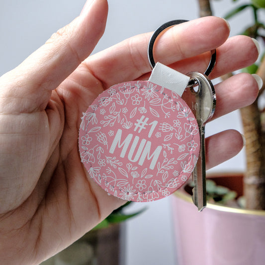 Round Pink keychain with '#1 MUM' text and floral design, perfect to show mum some love