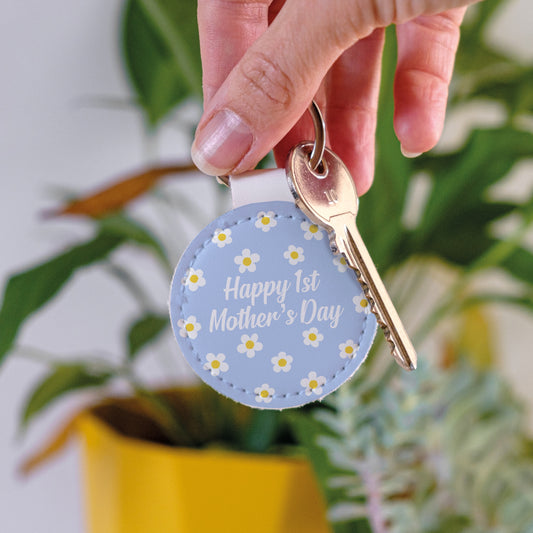 Blue Leather Keychain with 'Happy 1st Mother's Day' writing and small white floers.