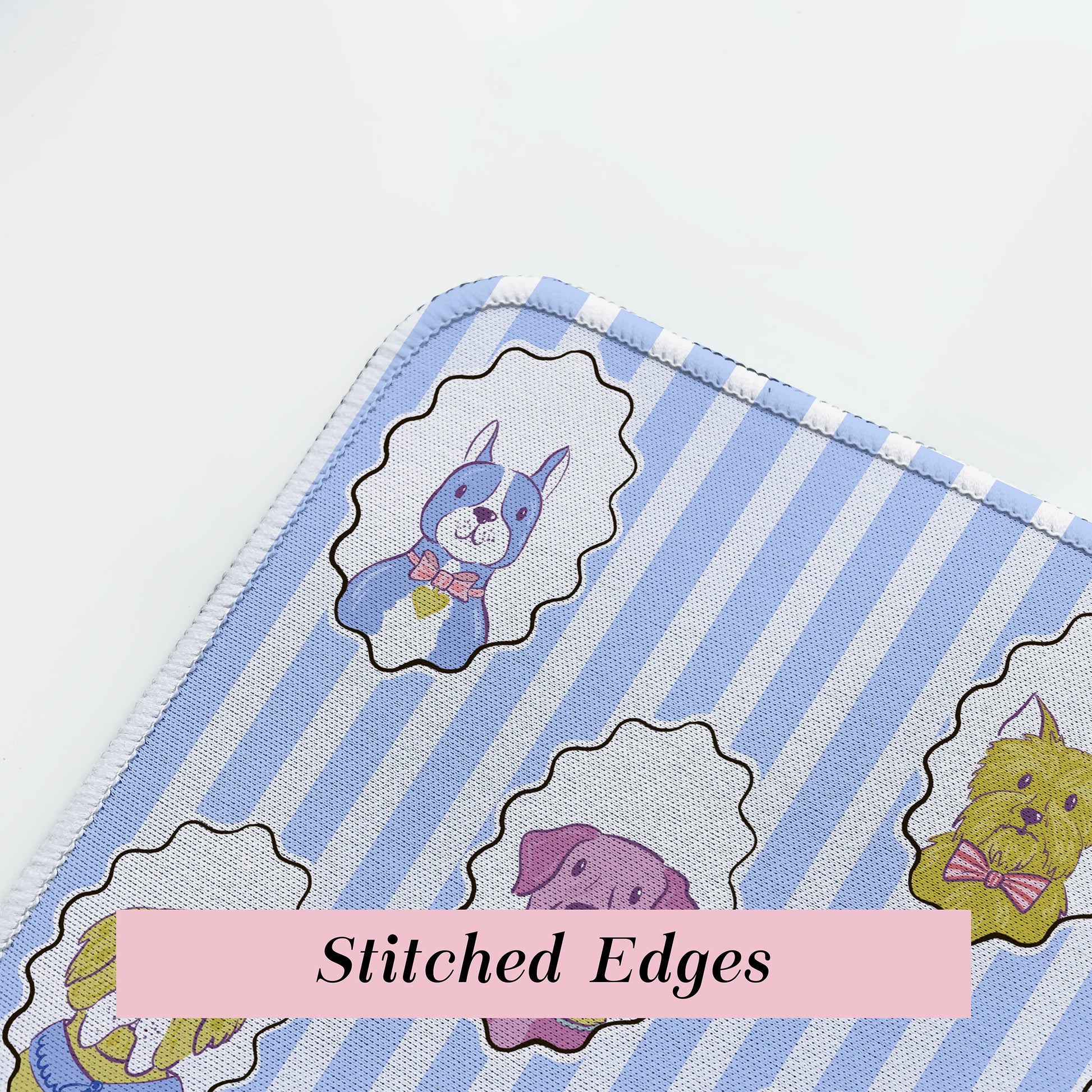 close up on blue dog desk mat corner stitching