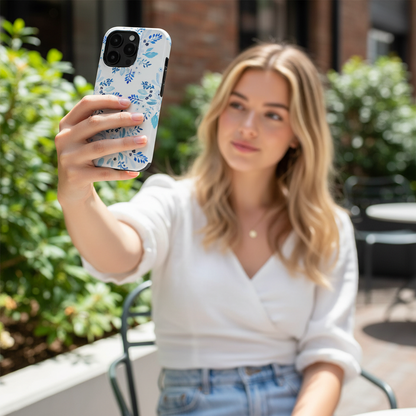 Woman taking a selfie with a phone protected in Blue Florals Tough Phone Case