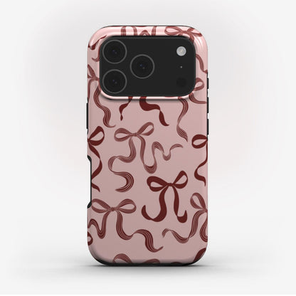 Festive Christmas phone case with elegant ribbons, glossy finish, and dual-layer protection for iPhone, Samsung, and Pixel.