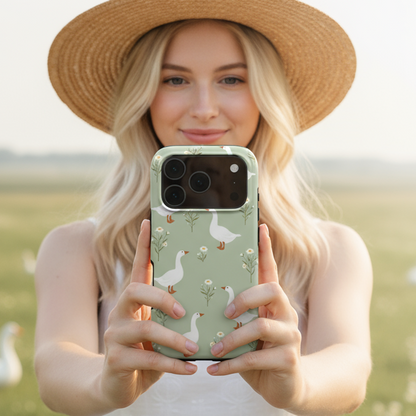 A woman holding a phone with the Green Goose Phone Case showing it in real life use-a glossy, art-inspired accessory that blends beauty and protection for everyday use