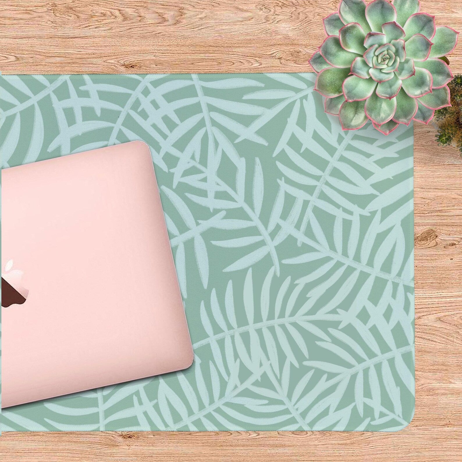 Green Botanical Desk Mat in use with a laptop desk setup