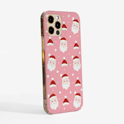 Side view of the Jolly Santa phone case showing cute festive print with watercolour santa faces on a soft pink background and clear sides of the case for a sleek look. 