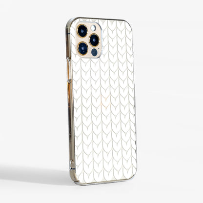 Side view of knitted pattern clear phone case showing transparent sides and cozy winter design.