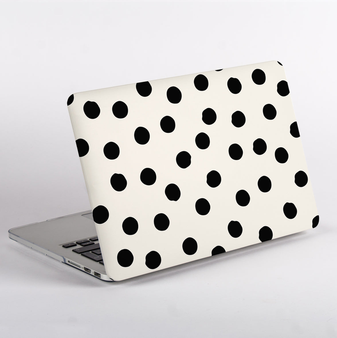 Protective yet lightweight MacBook case with stylish polka dot pattern,  showing no apple logo cutout.