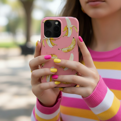woman holding a phone with a Pink Banana Tough Phone Case featuring banana print, showing the cover in real life