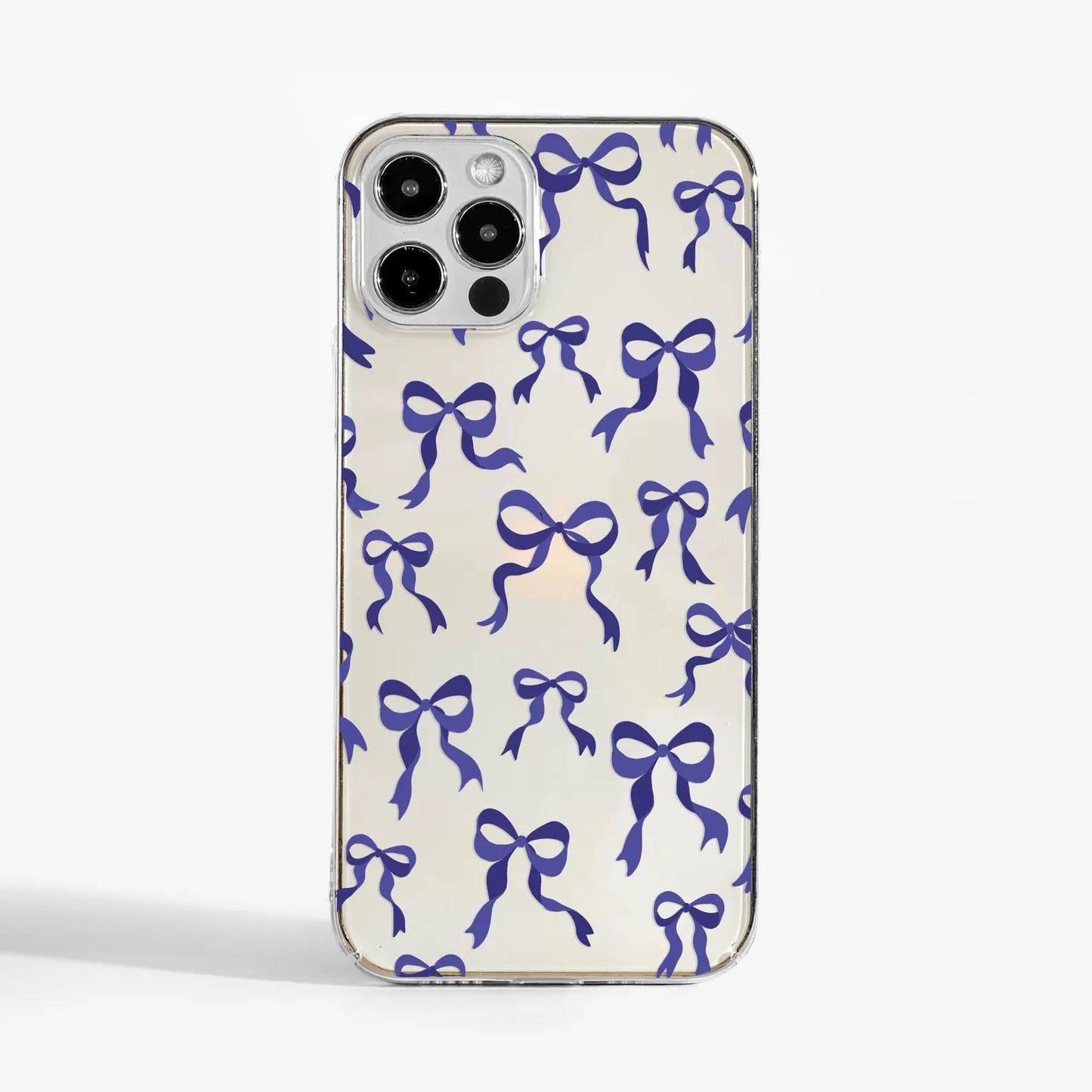 Clear phone case with purple ribbon bow print — a stylish and protective designer phone case for women who love soft, feminine details.
