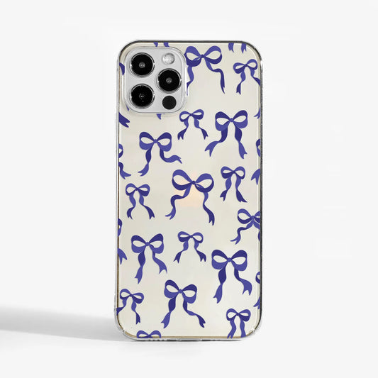 Clear phone case with purple ribbon bow print — a stylish and protective designer phone case for women who love soft, feminine details.