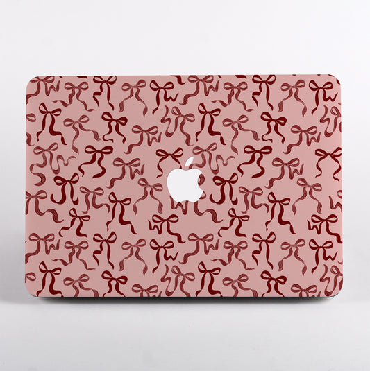 Aesthetic Ribbon Bows MacBook Case with pink hand-painted ribbon design. Cute and protective laptop cover that adds personality to your workspace.