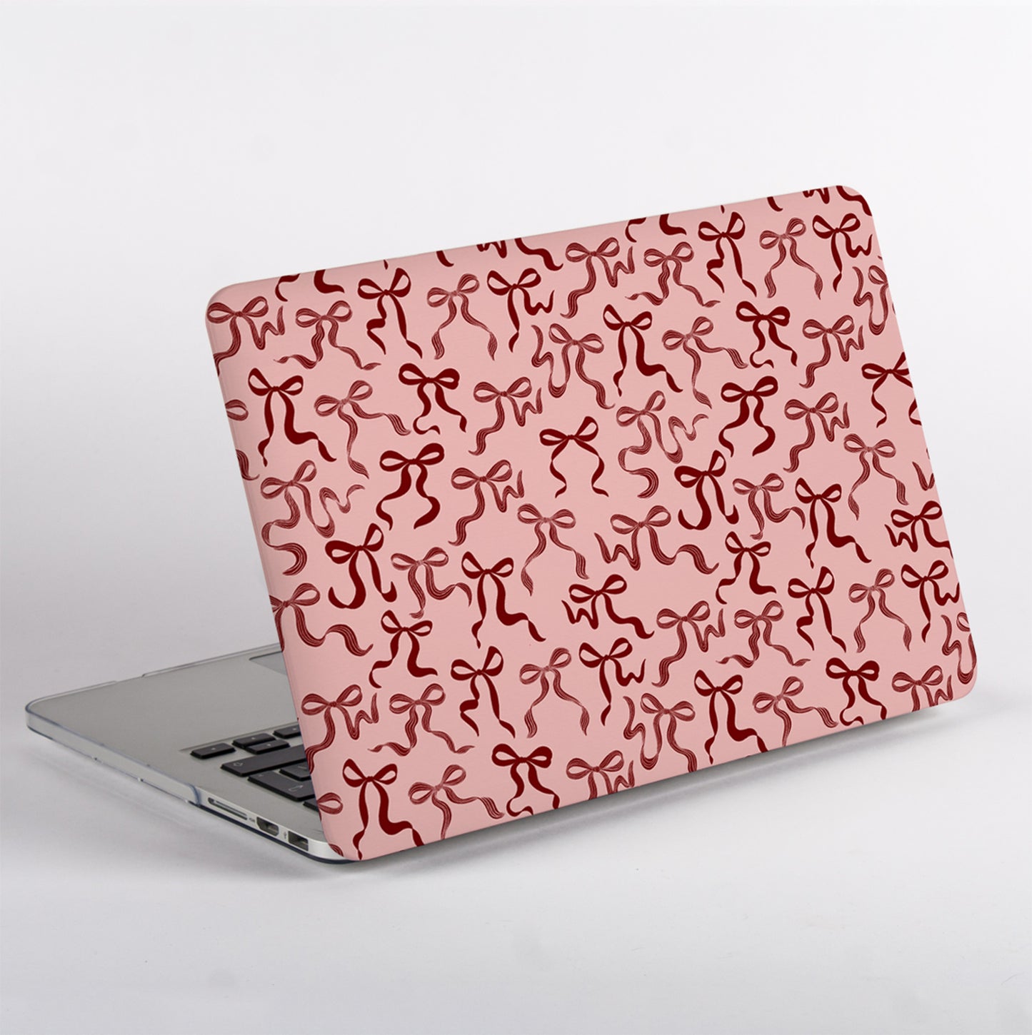 Side view of Ribbon Bows MacBook Case showing slim, protective fit and smooth matte finish without Apple Logo cutout. Stylish MacBook case for creative setups.
