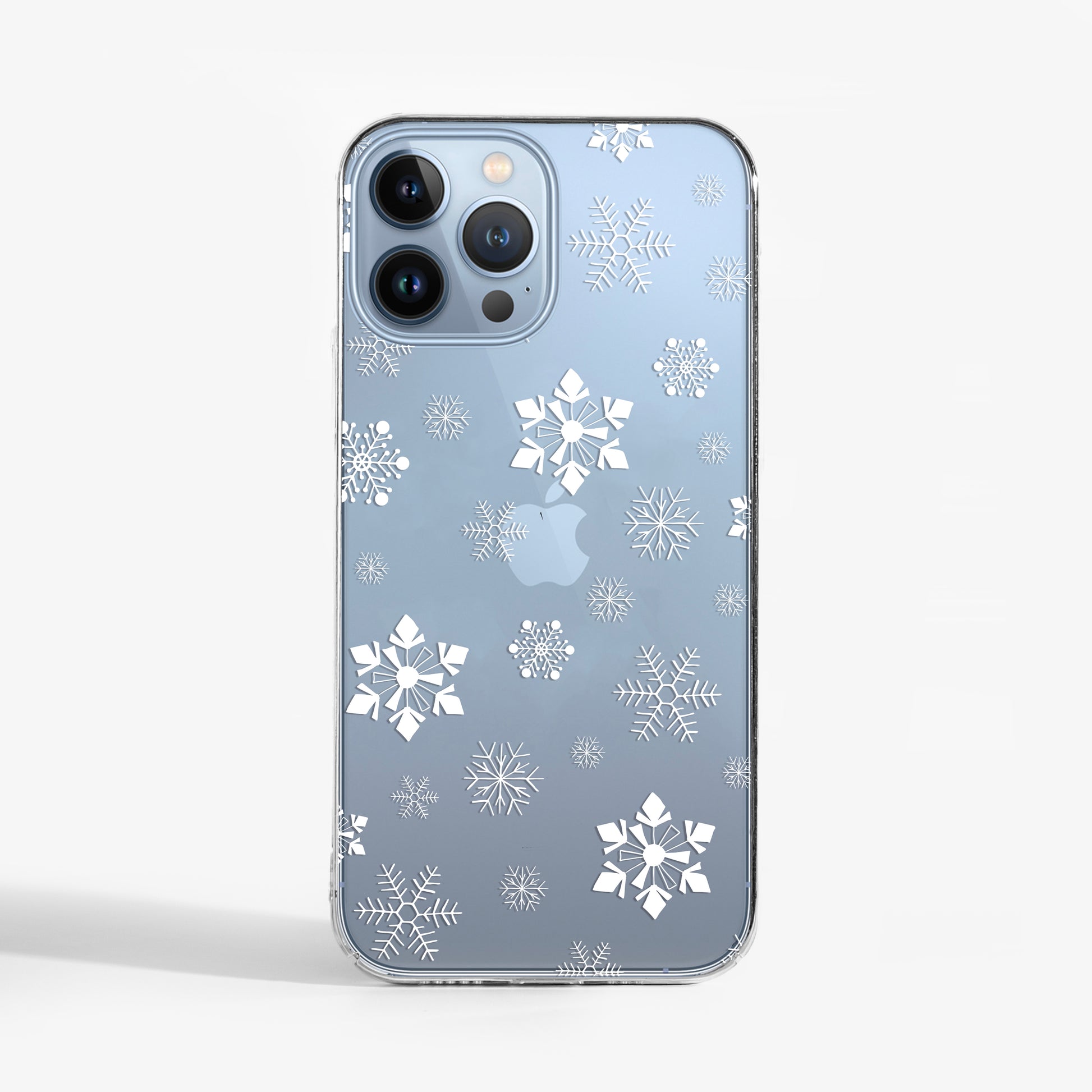 Small Snowflakes Clear Phone Case on a blue iPhone 15