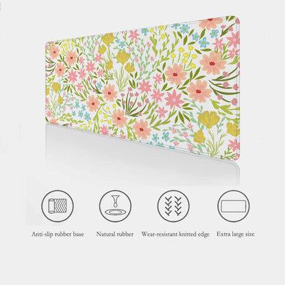 Floral desk mouse pad highlighting the product features listed below -smooth surface, non-slip base made from natural rubber and stitched edges  — floral, padded, and durable.