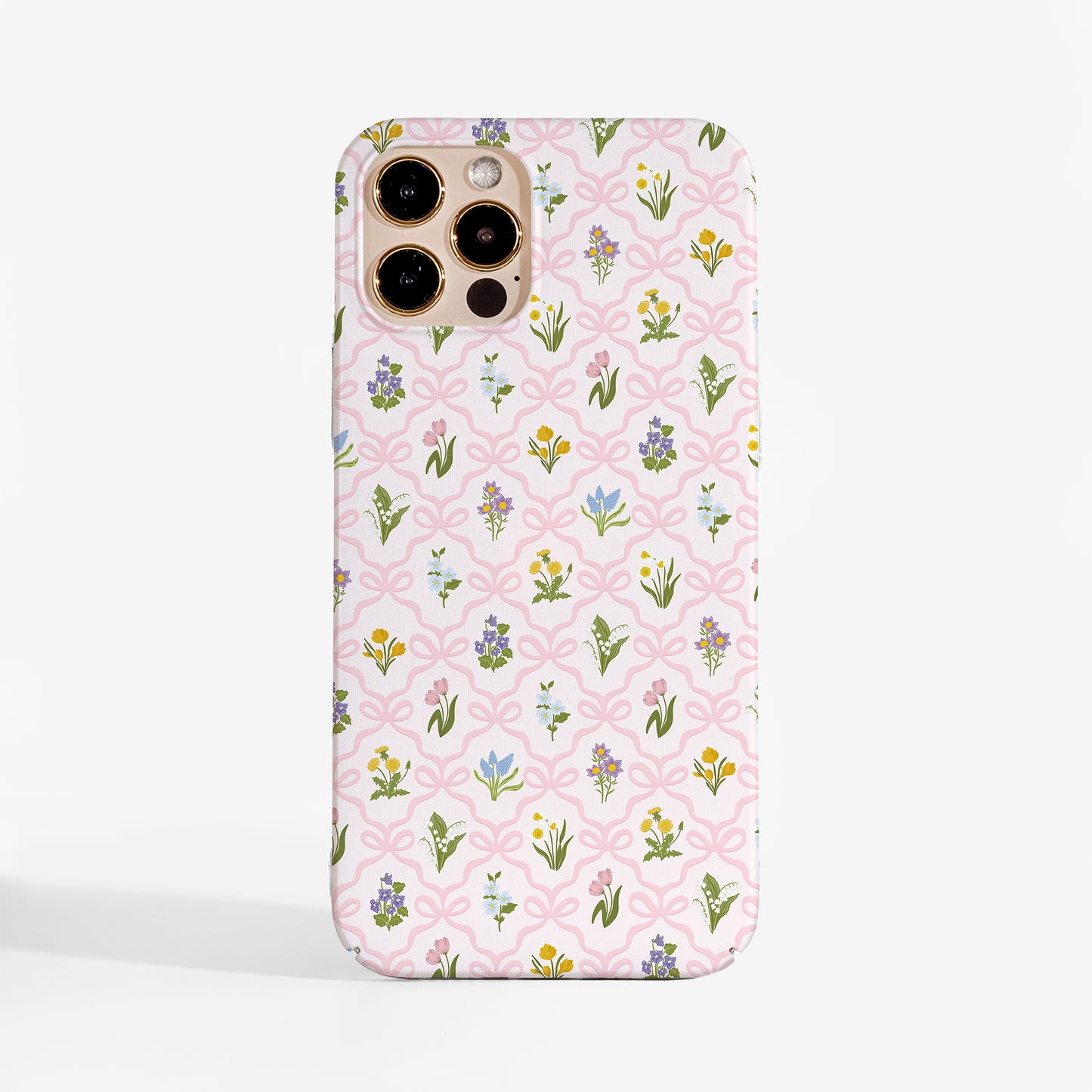 Tough phone case with a vintage wildflower pattern and soft pink bow lattice for feminine floral aesthetic