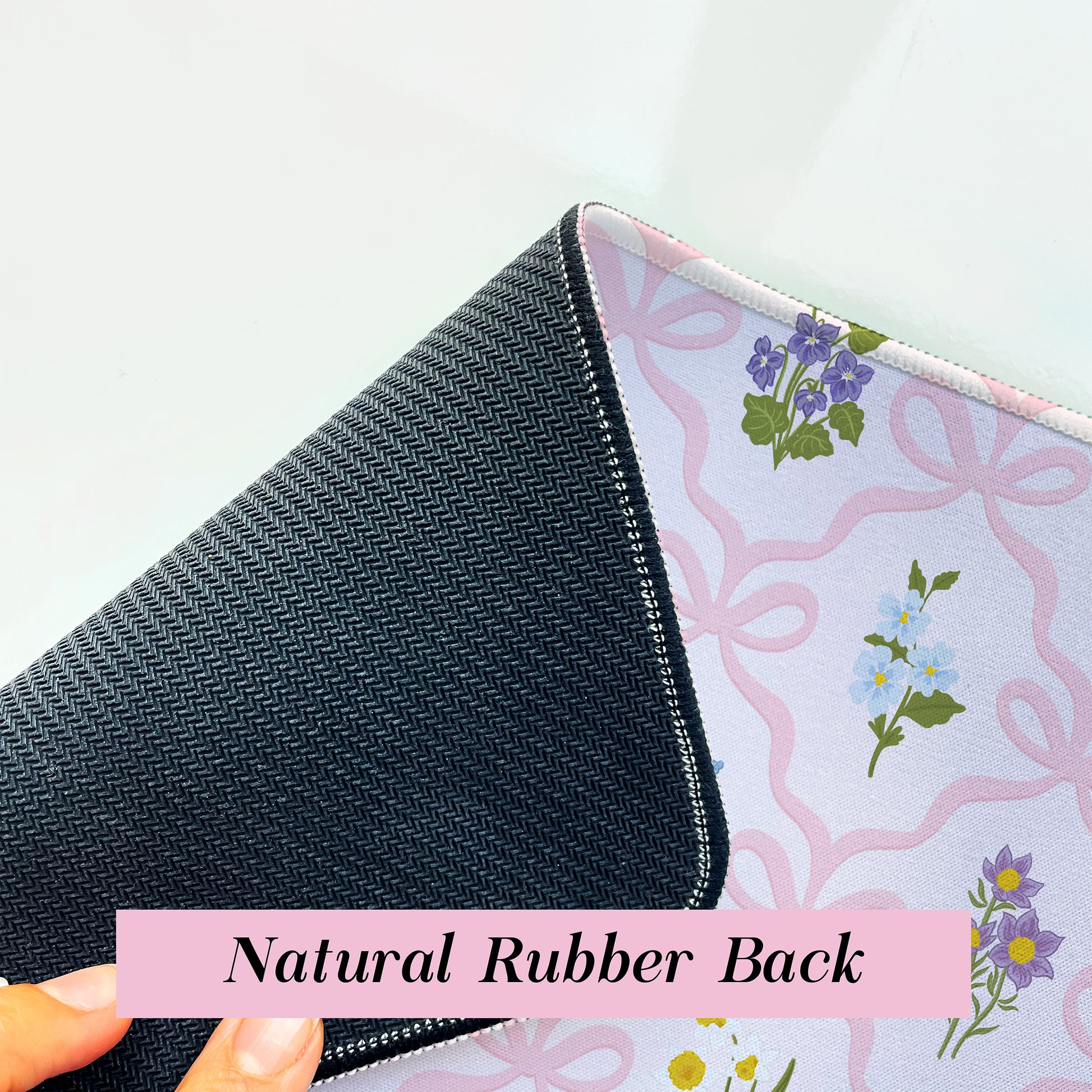 Wildflower desk mat with a non-slip rubber backing to help keep the mat securely in place during daily use.