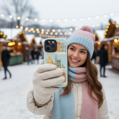 Woman holding a phone with a winter-themed case showing it in real life 
