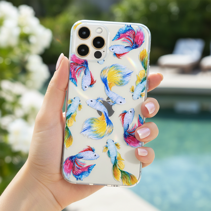 Woman holding clear betta fish phone case showing colourful tropical aesthetic