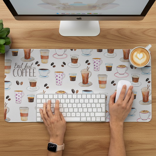 person working on a desk with coffee desk mat featuring watercolour coffee illustrations for a desk setup that feels like you.