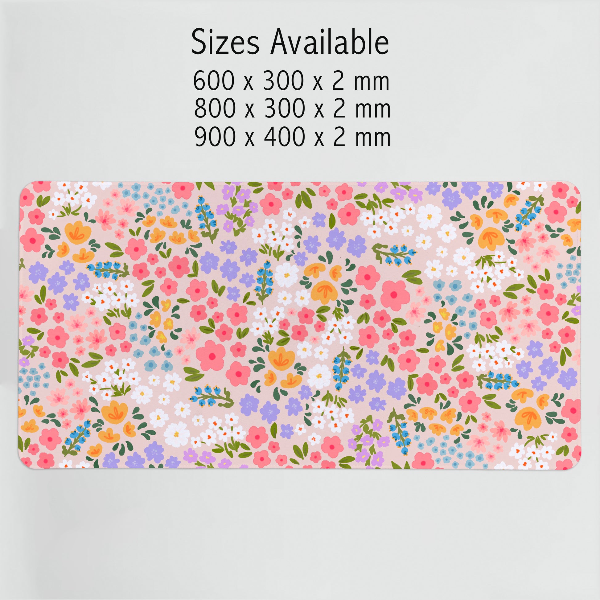 Floral patterned desk mat with size specifications on a light gray background