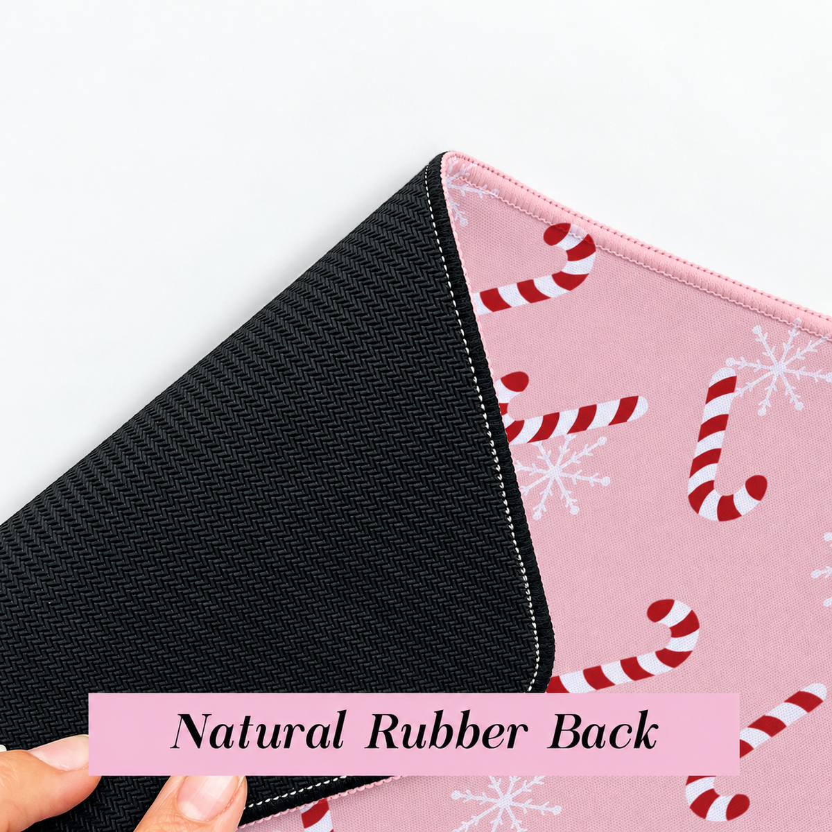 Textured black natural rubber backing on the Candy Cane Desk Mat