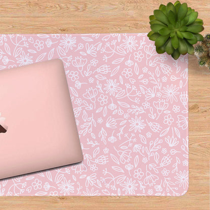 Zoomed in shot on the pink flowers desk mat showing the pretty floral design