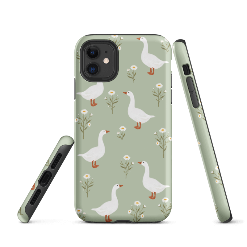 iPhone 15 Geese Tough Case with glossy wrap around print, featuring geese on  a green background and dual- layer protection — a bold, art-inspired design that keeps your phone safe in style.