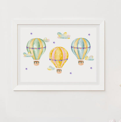 Framed artwork of colorful hot air balloons on a white wall