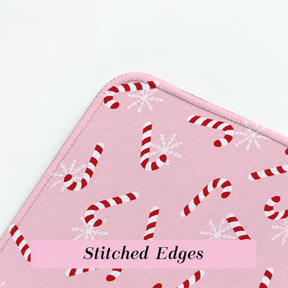 Close-up of stitched edges on the pink candy cane desk mat