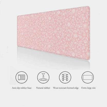  pink floral desk mat showing key features such as anti-slip rubber base, waterproof surface, stitched edges and extra large sizes.