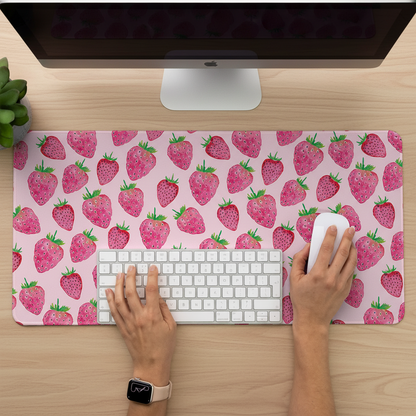 woman working on her desk with the strawberry desk mat