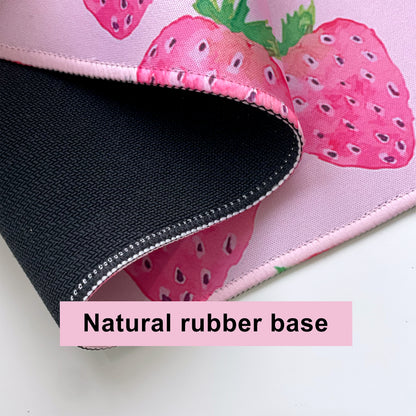 Desk mat with strawberry pattern and natural rubber base for stabiltiy 