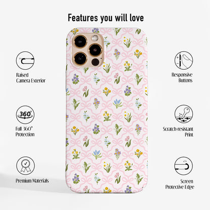 Hard plastic phone case with a vintage wildflower and pink bow pattern, featuring a slim profile, precise cut-outs and durable scratch-resistant print.