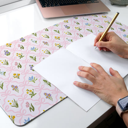 Wildflower desk mat with a soft pink bow pattern for a feminine floral aesthetic desk setup