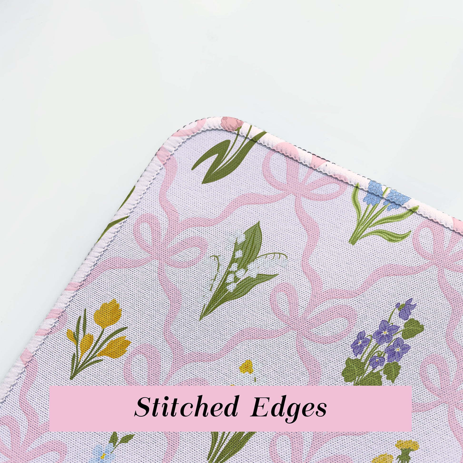 Fabric with floral pattern and stitched edges
