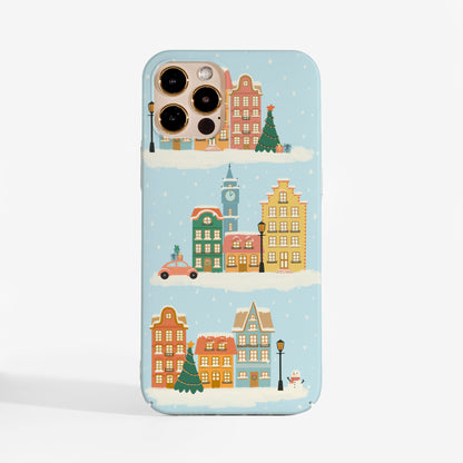 Phone Case featuring hand-illustrated scene of a cozy town dressed in winter magic on a light blue background, this case blends beauty with protection, perfect for the winter season